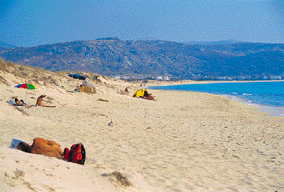 Plaka Beach in Naxos with long golden sand and blue sea